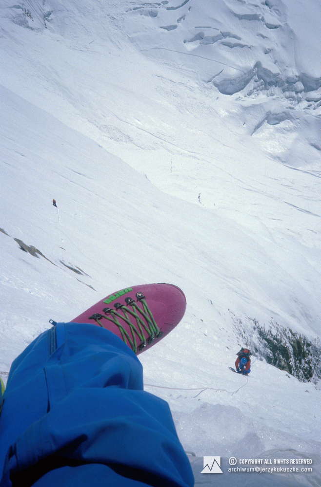 Ramiro Navarrete while climbing. The photo is taken by Artur Hajzer. Steve Untch visible in the distance.